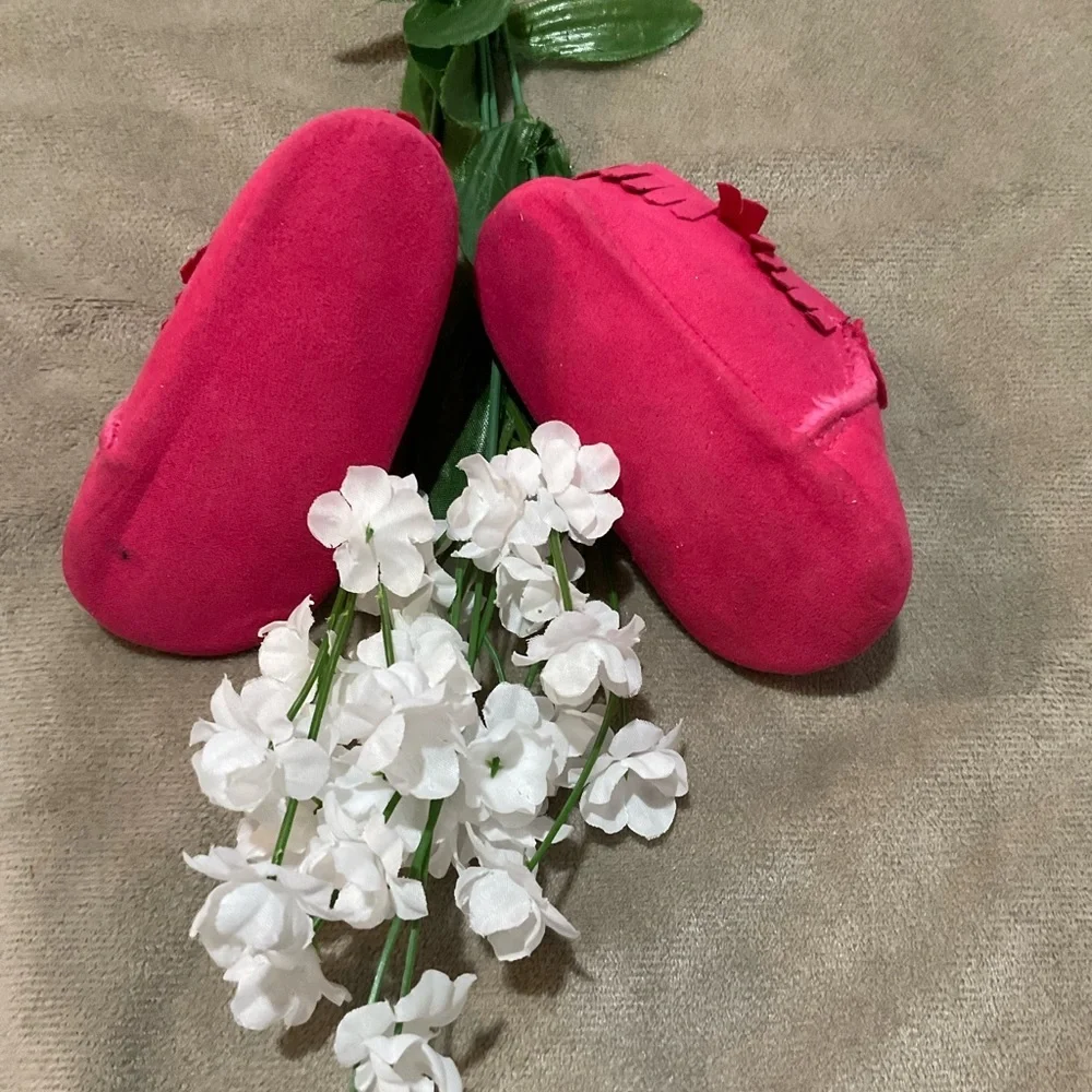 Child of Mine Pink Fringed Baby Moccasins with fleece lining.